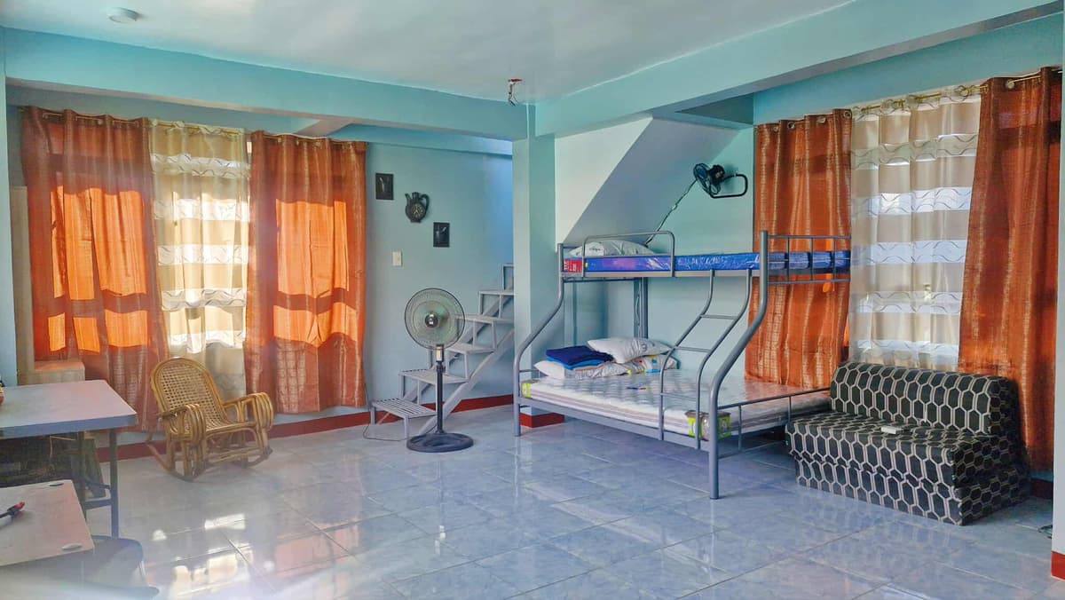 Spacious bedroom with bunk bed and sofa