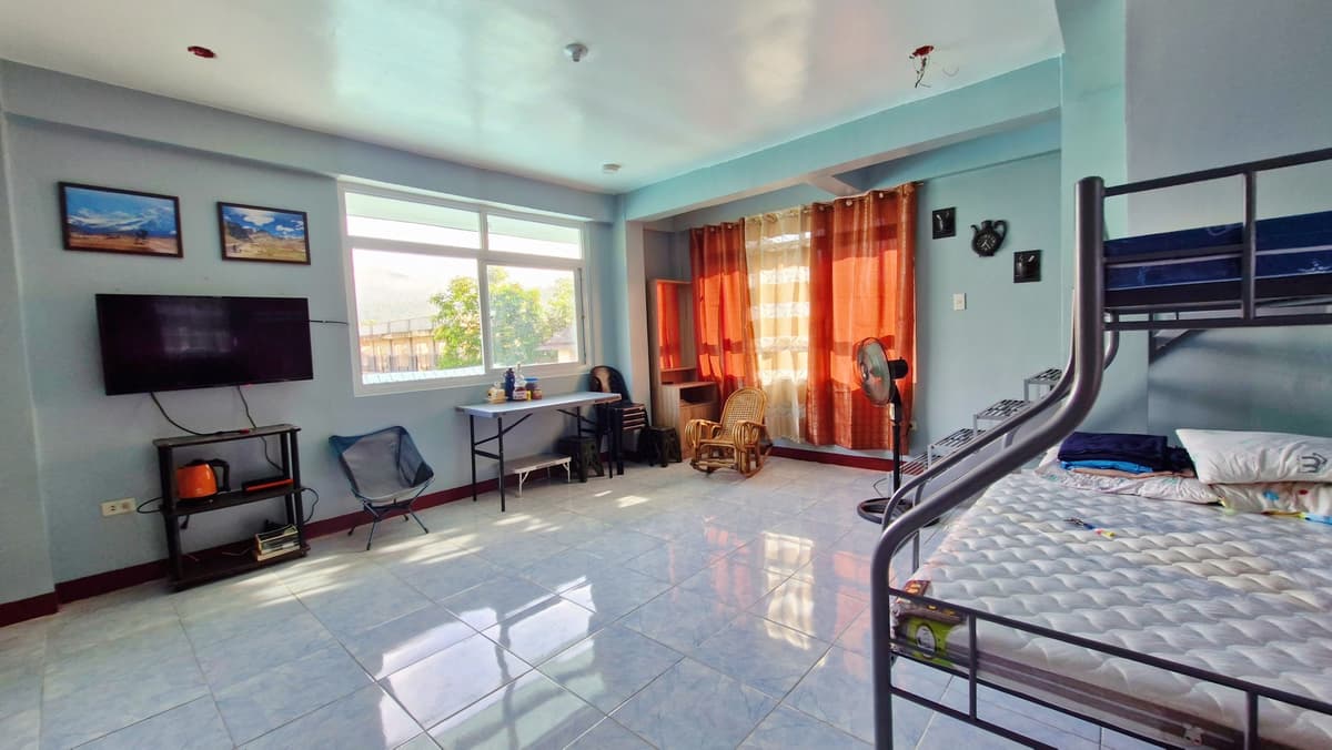 Spacious bedroom with bunk bed and TV