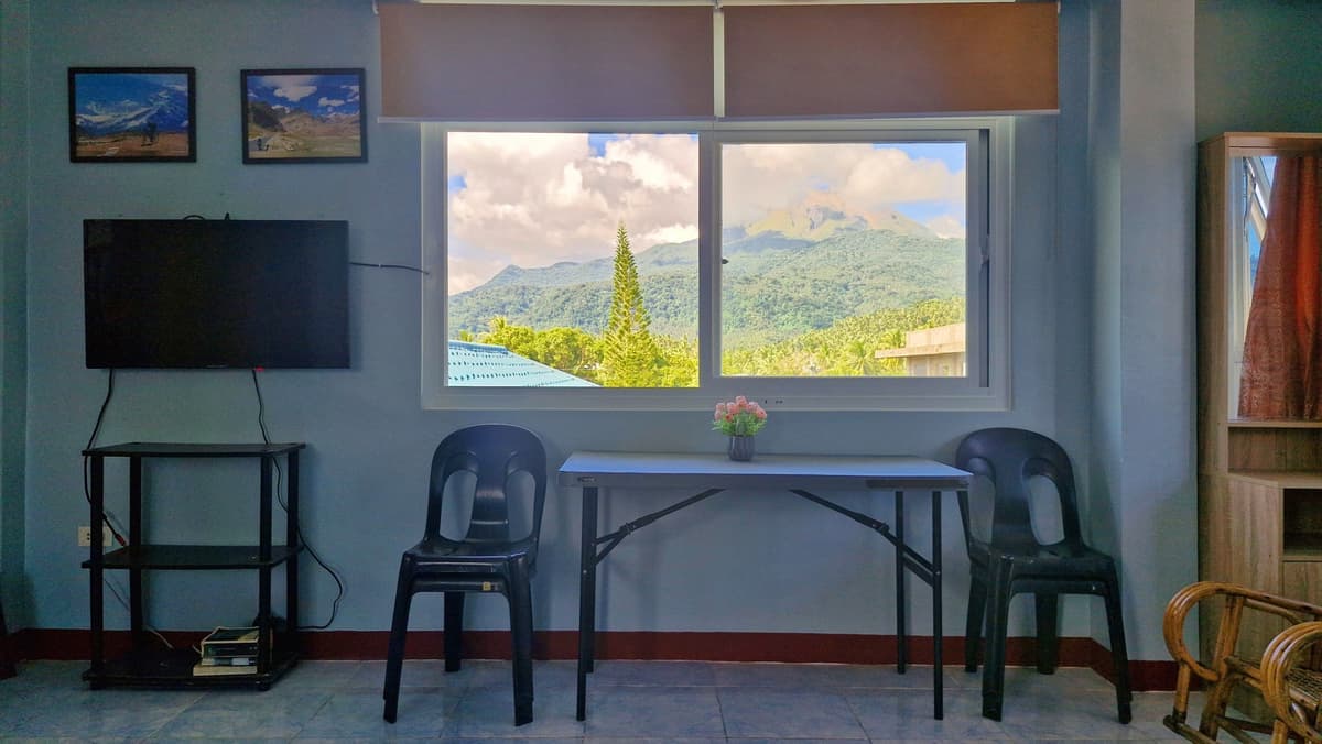 Dining nook with mountain-framed window view